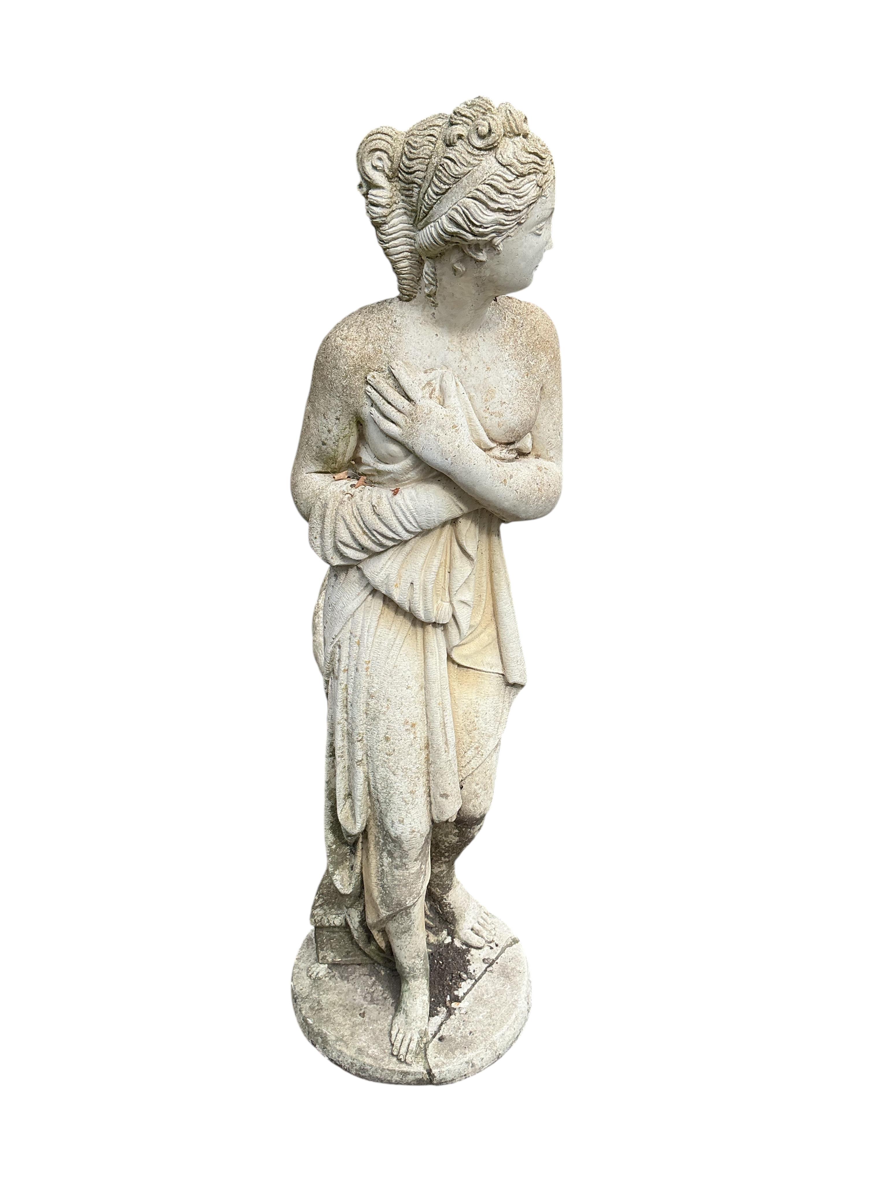 A reconstituted stone garden ornament of a female bather, base damaged, height 116cm